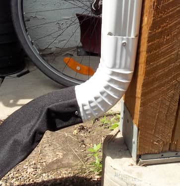 Attached to eavestrough downspout with screw